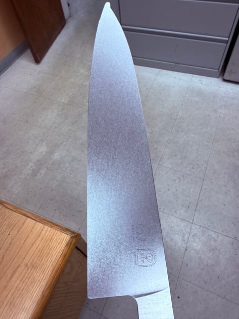 Industrial knife blade on workbench